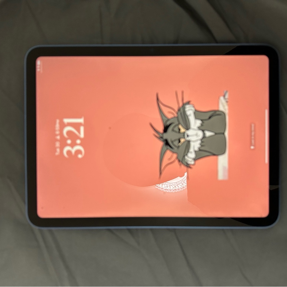 Apple Tablet with Blue Frame and Cartoon Display
